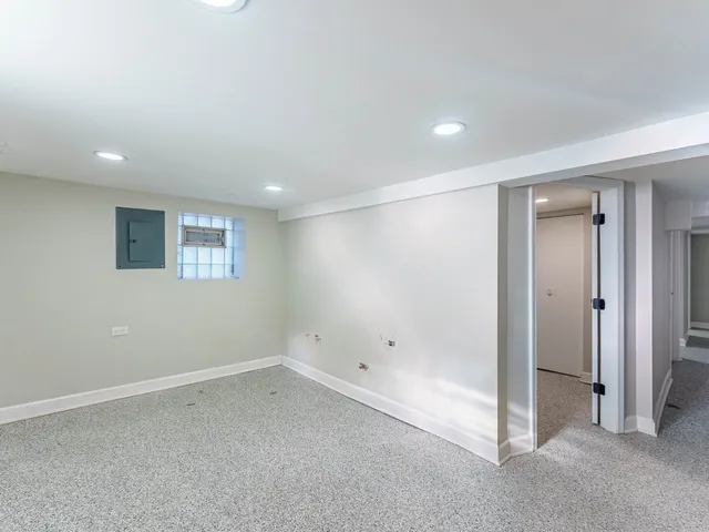a view of an empty room with a bathroom