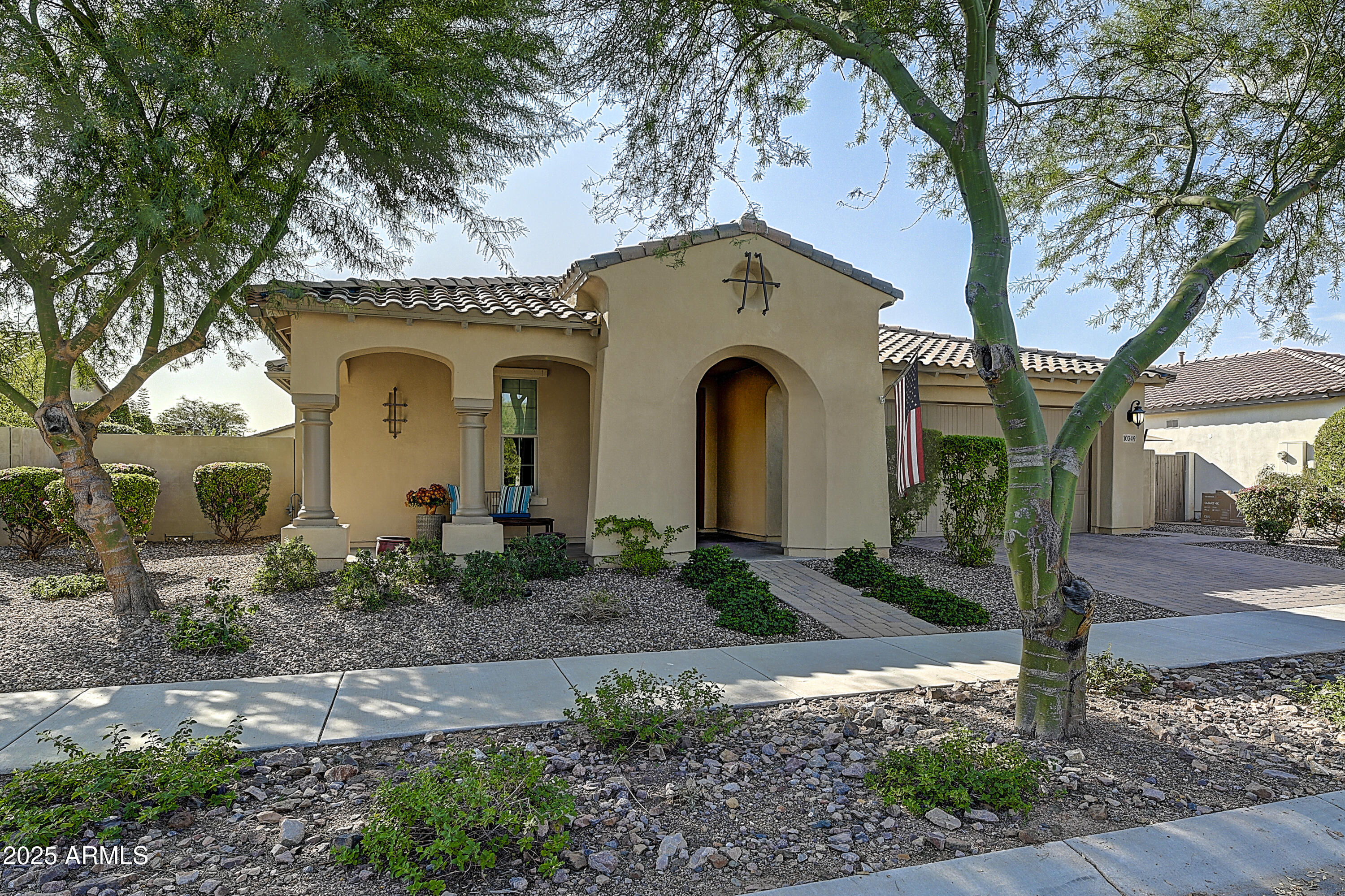 a front view of a house with garden