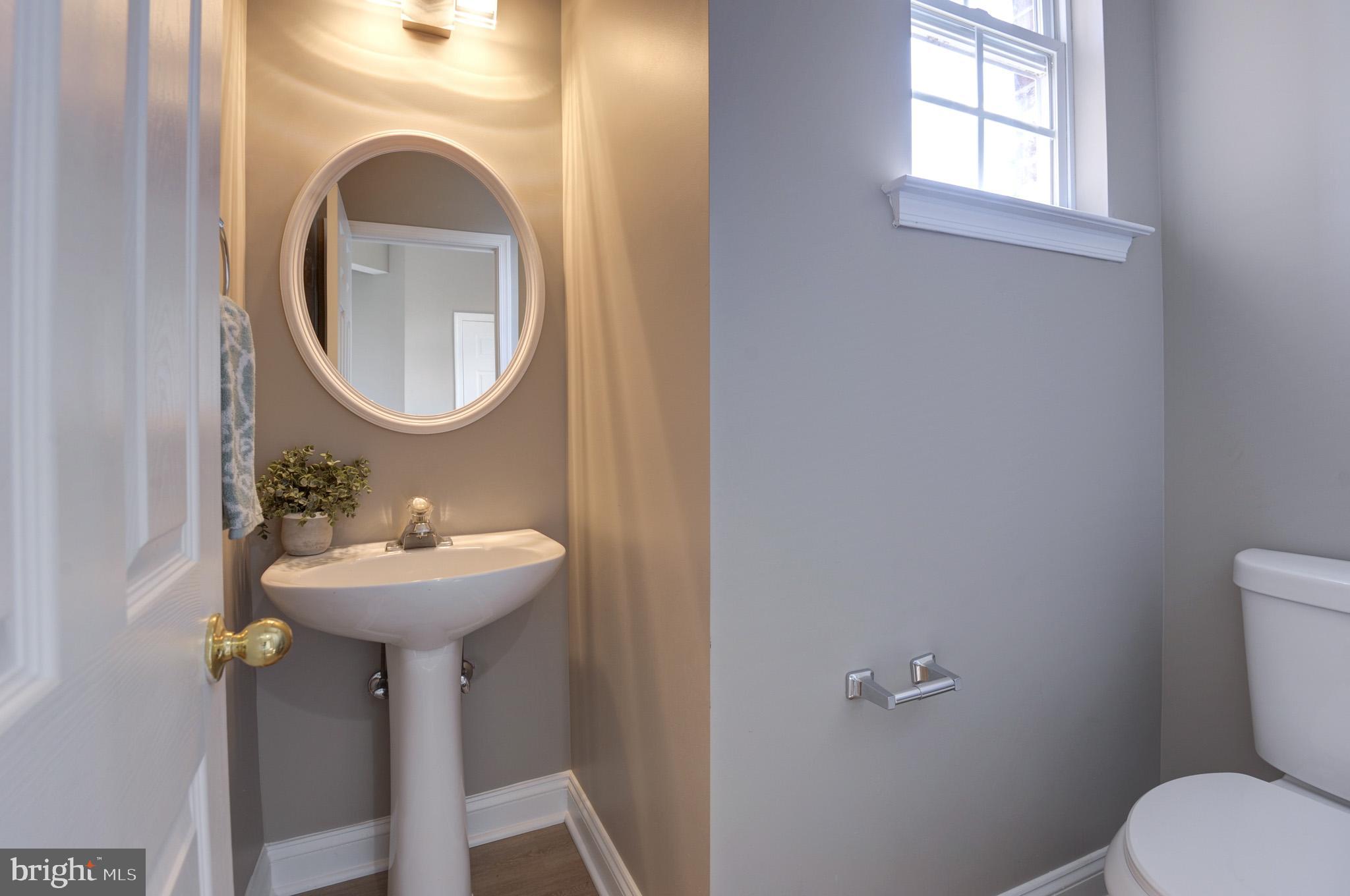 615 Springhouse Square Southeast Leesburg, VA 20175 - Photo 14 of 36 Half bath main level with new toilet