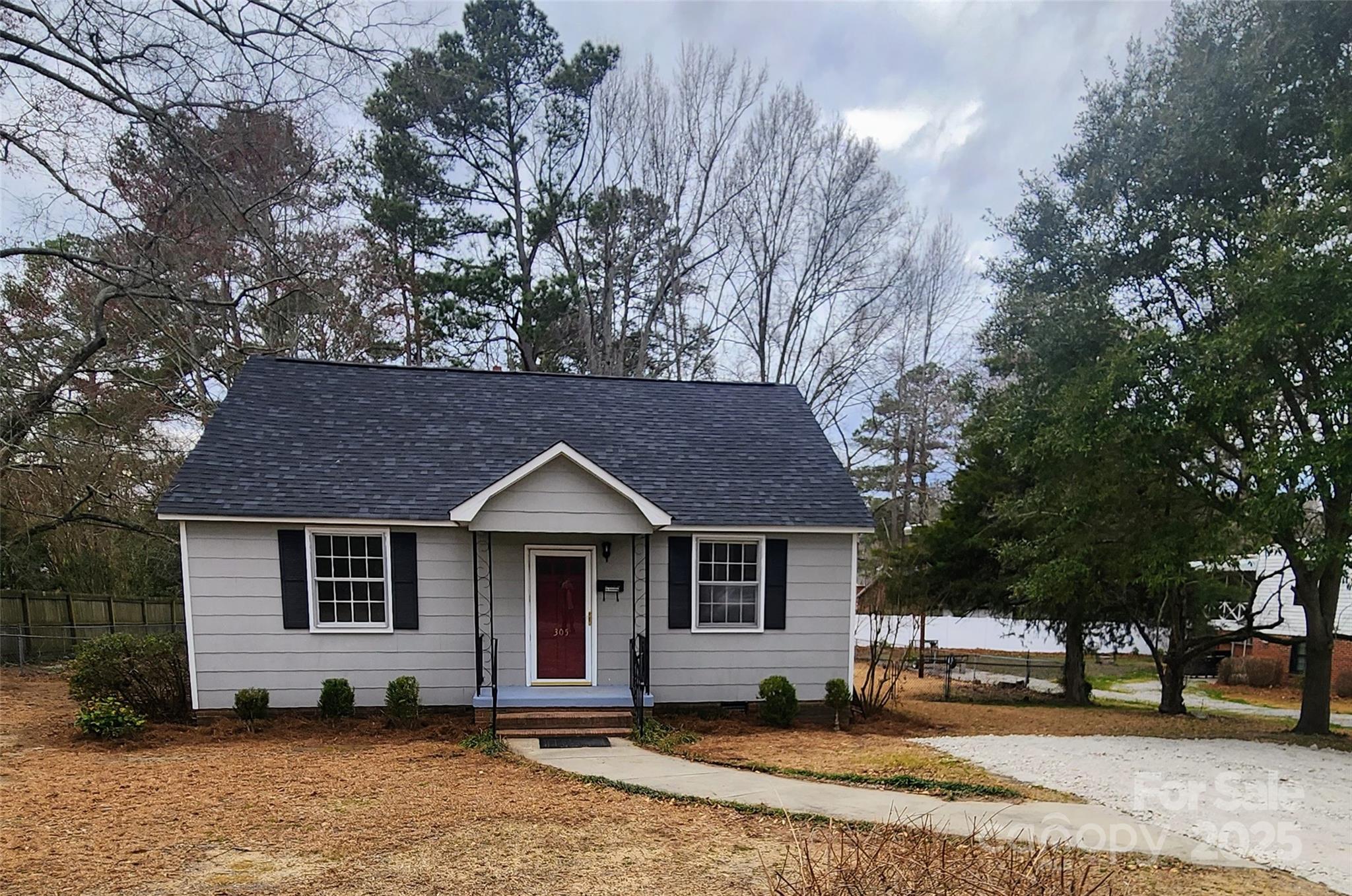 305 Louise Avenue Rockingham, NC 28379 - Photo 2 of 20 a front view of a house with a yard