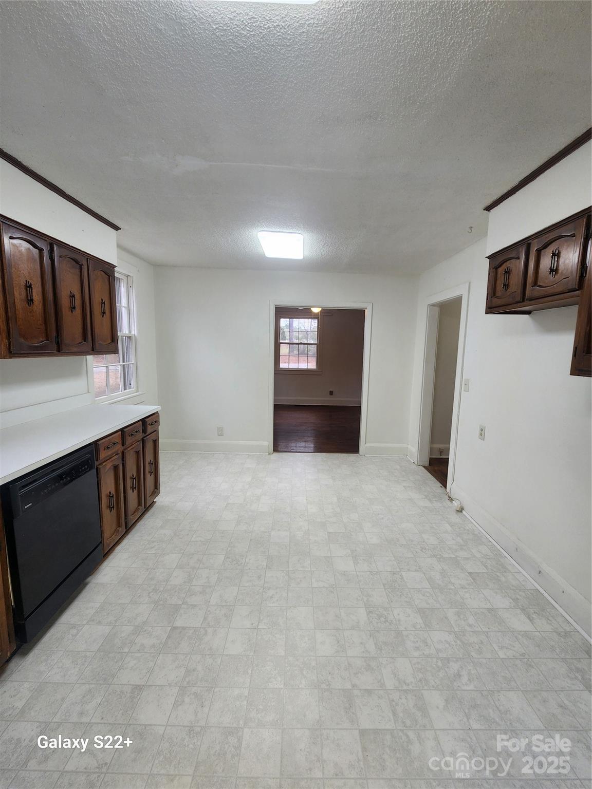 305 Louise Avenue Rockingham, NC 28379 - Photo 7 of 20 a view of an empty room with a fireplace