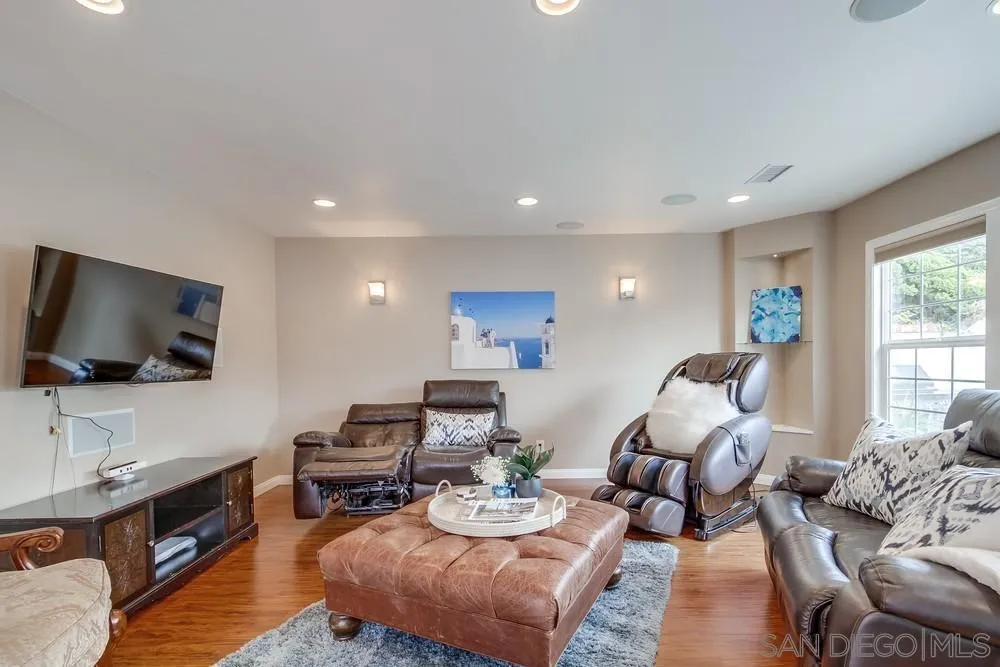 754 A Avenue Coronado, CA 92118 - Photo 14 of 25 a living room with furniture and a flat screen tv