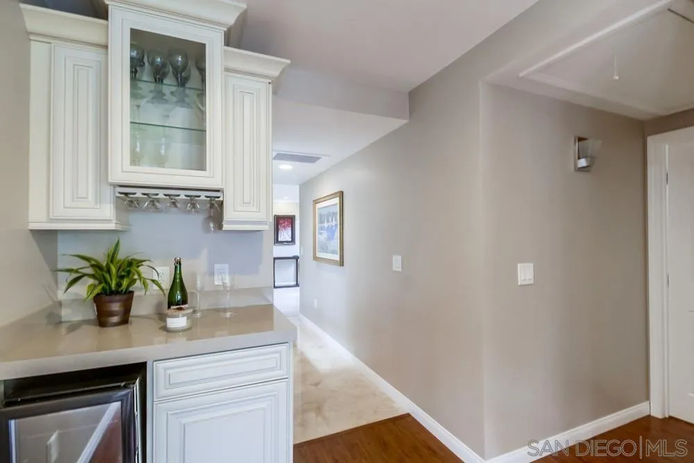 754 A Avenue Coronado, CA 92118 - Photo 15 of 25 a kitchen with stainless steel appliances granite countertop a sink a stove and a window