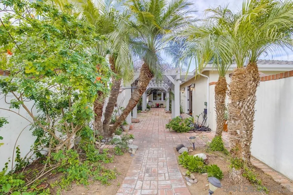 754 A Avenue Coronado, CA 92118 - Photo 2 of 25 a front view of a house with garden