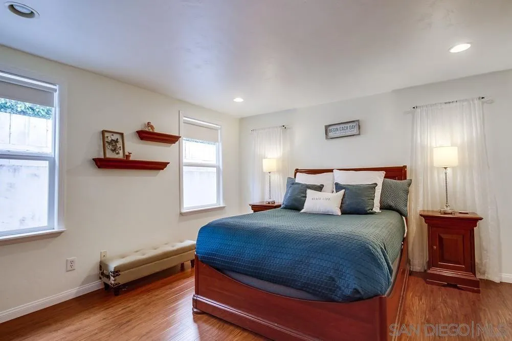 754 A Avenue Coronado, CA 92118 - Photo 21 of 25 a bedroom with a bed and wooden floor