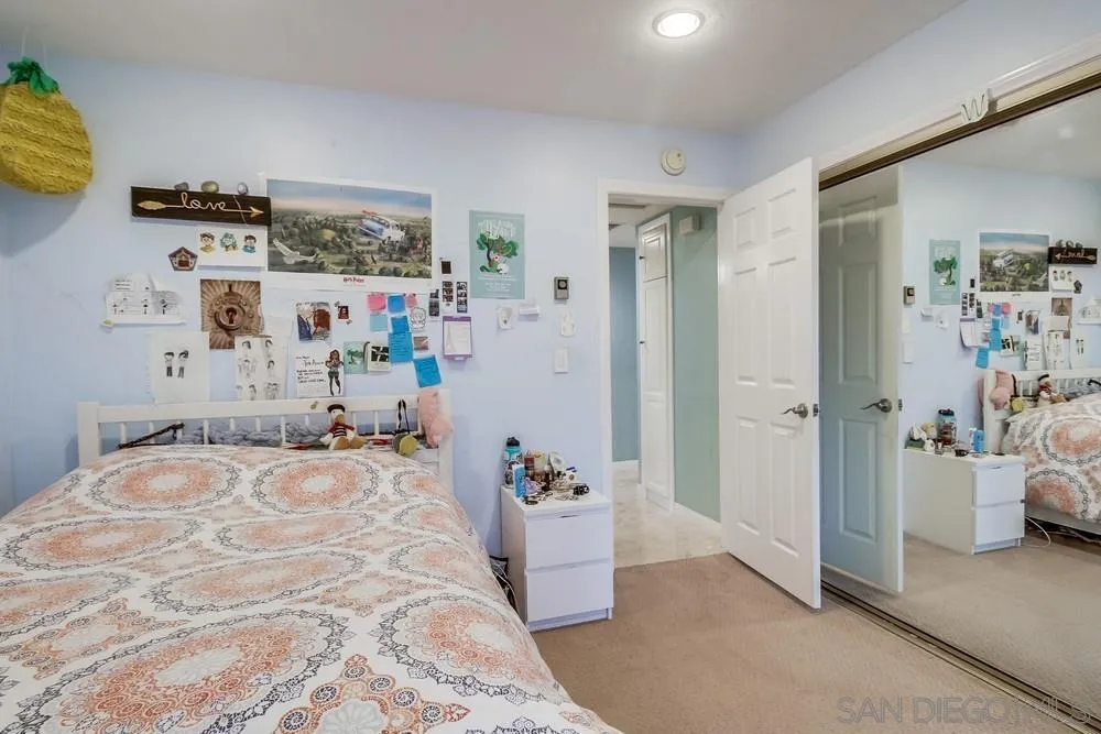 754 A Avenue Coronado, CA 92118 - Photo 24 of 25 a bedroom with a bed and a cabinets