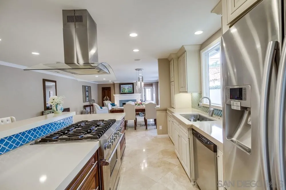 754 A Avenue Coronado, CA 92118 - Photo 10 of 25 a kitchen with stainless steel appliances granite countertop a sink stove and refrigerator
