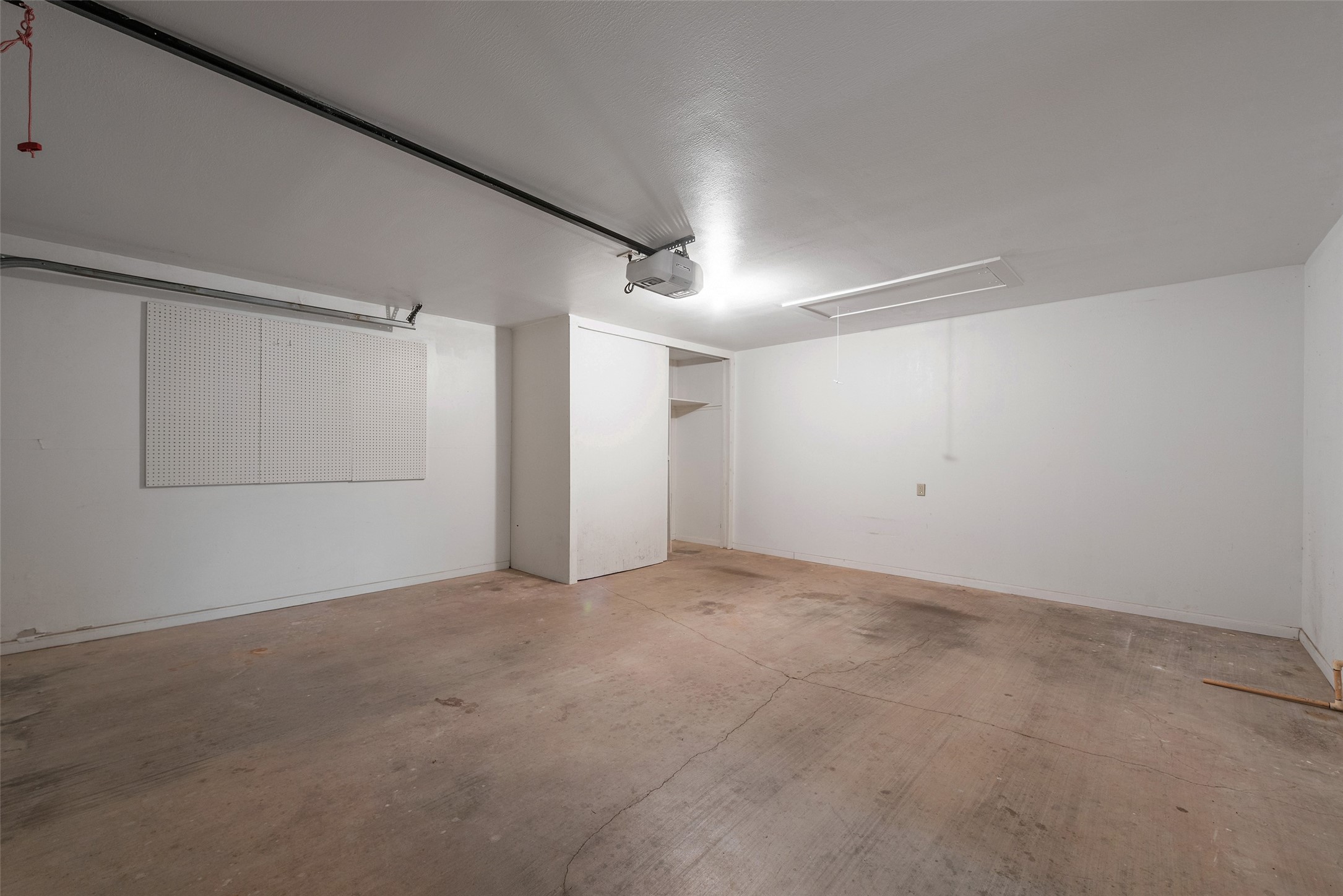 2017 Penick Road Waller, TX 77484 - Photo 20 of 28 Oversized garage with shelving towards the back