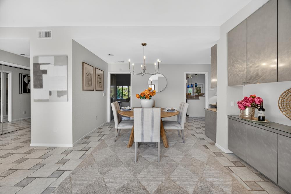 5033 El Cemonte Avenue Davis, CA 95618 - Photo 13 of 76 a view of a dining room with furniture and a chandelier