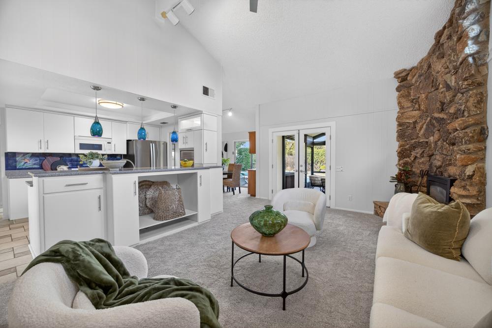 5033 El Cemonte Avenue Davis, CA 95618 - Photo 22 of 76 a living room with furniture and kitchen view