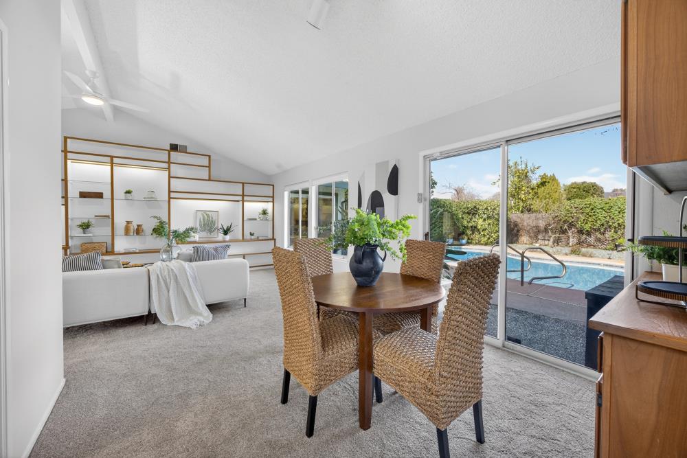 5033 El Cemonte Avenue Davis, CA 95618 - Photo 26 of 76 a dining room with furniture and a floor to ceiling window
