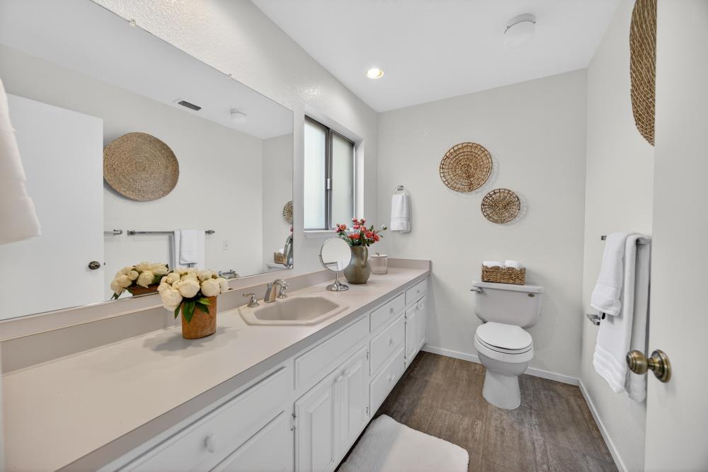 5033 El Cemonte Avenue Davis, CA 95618 - Photo 49 of 76 a bathroom with a double vanity sink mirror and toilet