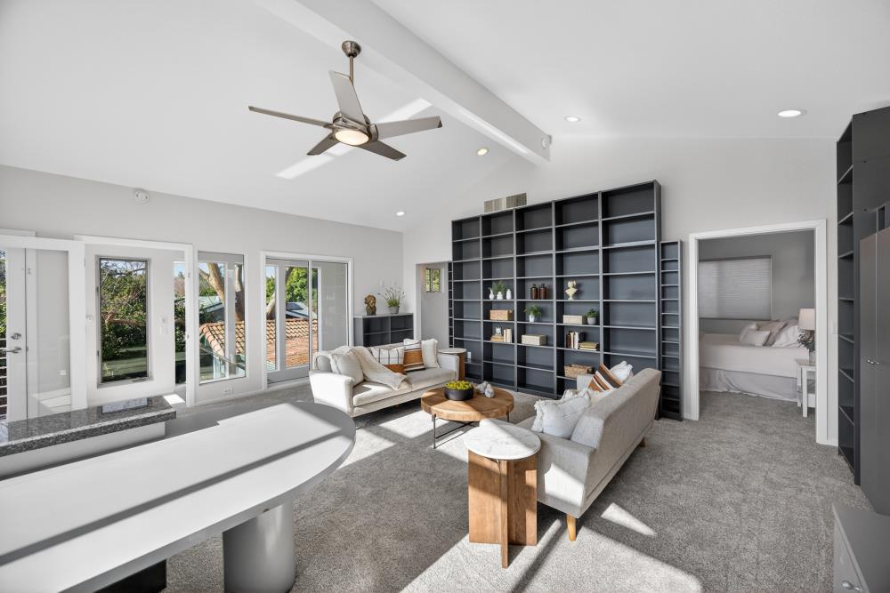 5033 El Cemonte Avenue Davis, CA 95618 - Photo 55 of 76 a living room with furniture a lamp and a large window