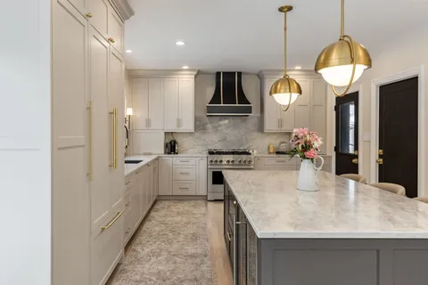 a kitchen with a stove and cabinets