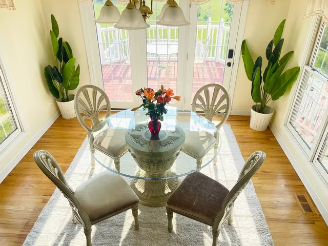 a view of a dining room with furniture window and outside view
