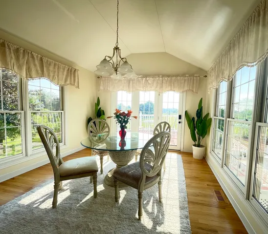 a view of a dining room with furniture window and outside view