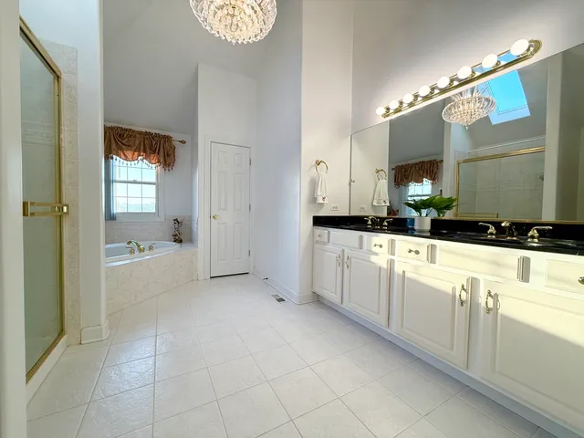 a bathroom with a bathtub and a sink