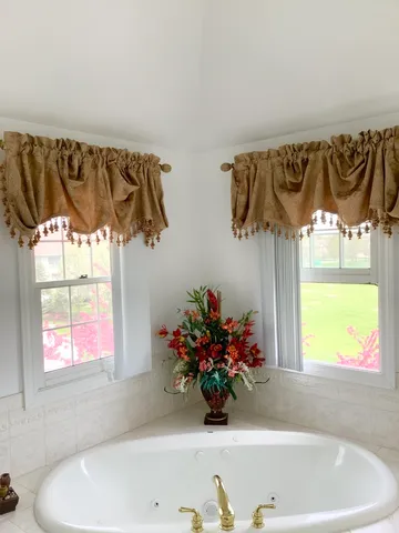 a bedroom with bed and window