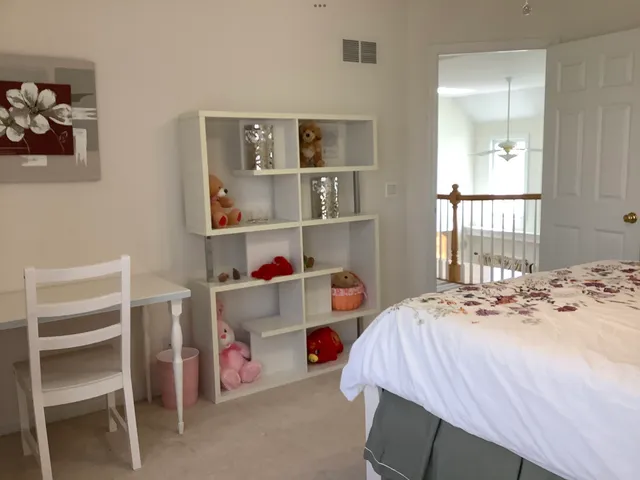 a spacious bathroom with a toilet sink and a mirror