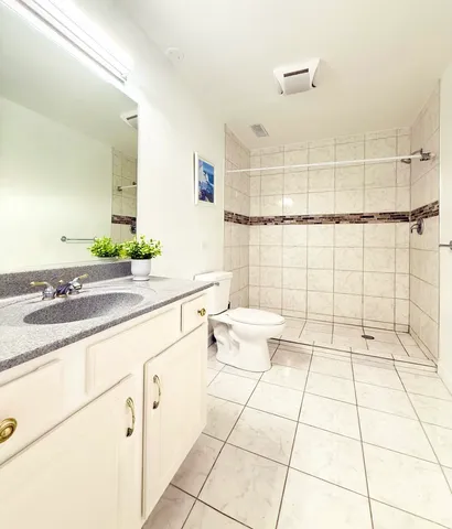 a view of balcony with wooden floor and fence