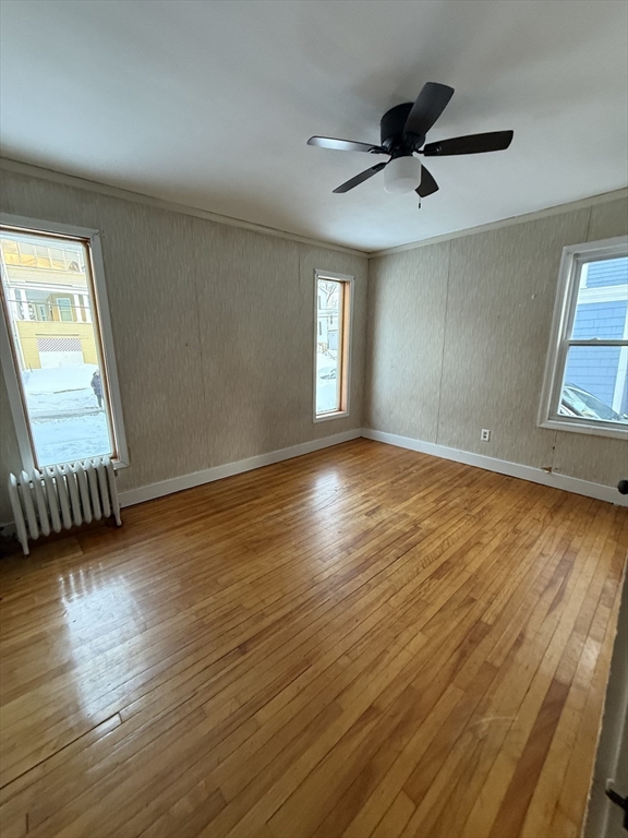 41 Holland Road, Unit 1 Worcester, MA 01603 - Photo 12 of 16 a view of an empty room with wooden floor and a window