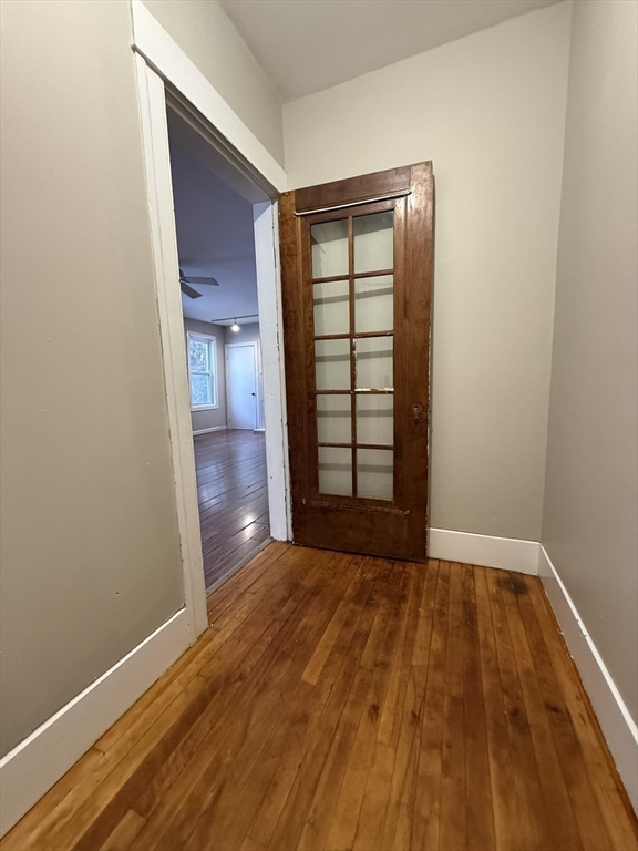 41 Holland Road, Unit 1 Worcester, MA 01603 - Photo 3 of 16 a view of empty room with window and wooden floor
