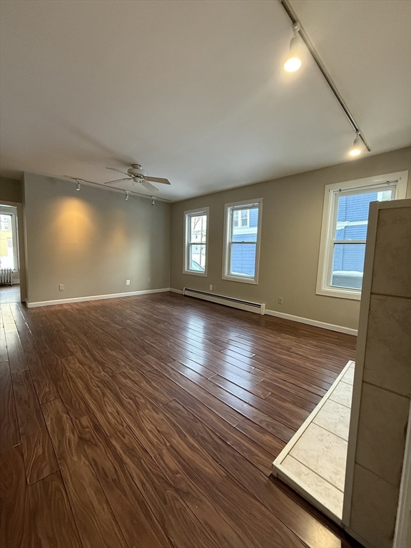 41 Holland Road, Unit 1 Worcester, MA 01603 - Photo 5 of 16 wooden floor in an empty room with a window