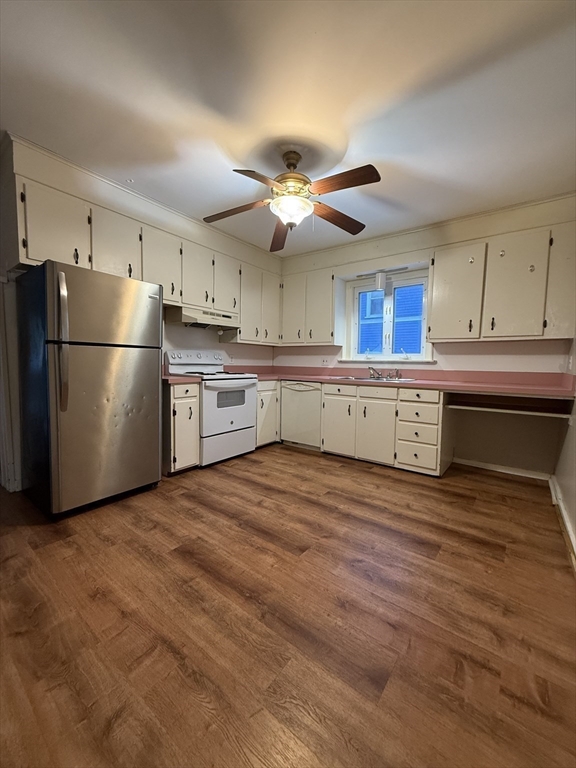 41 Holland Road, Unit 1 Worcester, MA 01603 - Photo 6 of 16 a kitchen with stainless steel appliances a refrigerator and a stove top oven