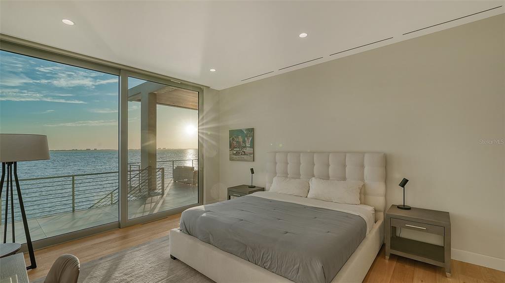 4123 Bay Shore Road Sarasota, FL 34234 - Photo 11 of 29 a bedroom with a bed and a night stand