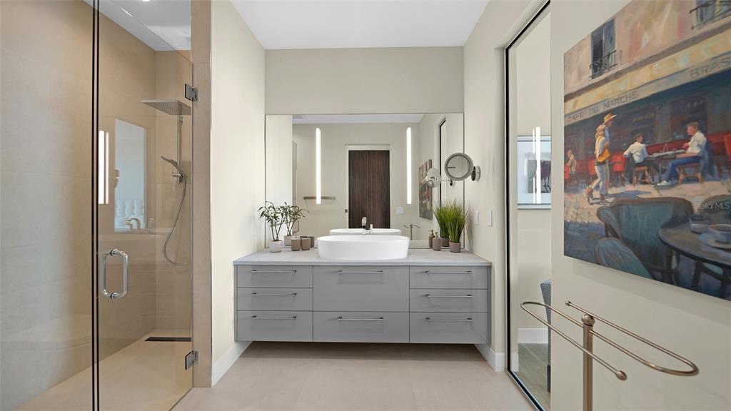 4123 Bay Shore Road Sarasota, FL 34234 - Photo 12 of 29 a bathroom with a double vanity sink and a mirror