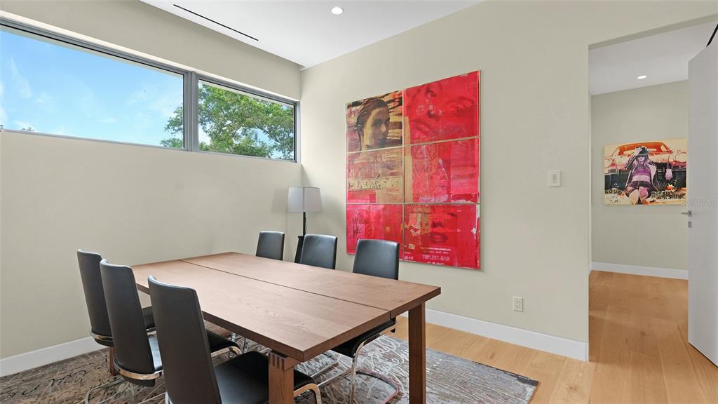 4123 Bay Shore Road Sarasota, FL 34234 - Photo 16 of 29 a view of a dining table and chairs in a room