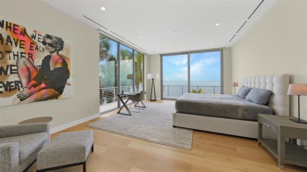 4123 Bay Shore Road Sarasota, FL 34234 - Photo 17 of 29 a living room with furniture and a floor to ceiling window
