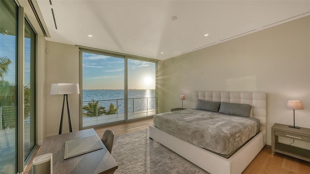 4123 Bay Shore Road Sarasota, FL 34234 - Photo 18 of 29 a spacious bedroom with a large bed and a large window