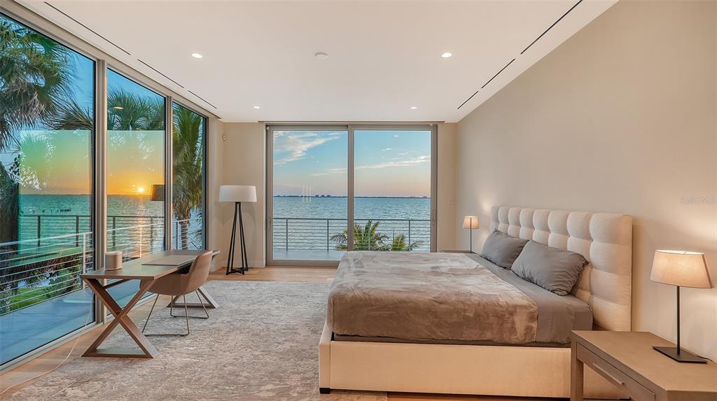 4123 Bay Shore Road Sarasota, FL 34234 - Photo 19 of 29 a bedroom with a bed and large glass window