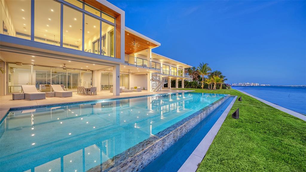4123 Bay Shore Road Sarasota, FL 34234 - Photo 22 of 29 a view of a house with a backyard