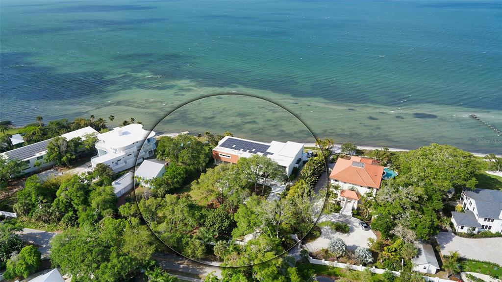 4123 Bay Shore Road Sarasota, FL 34234 - Photo 25 of 29 a backyard of a house with a yard and outdoor seating