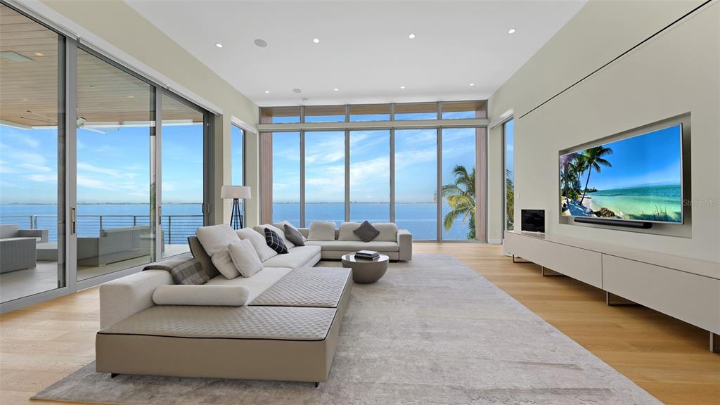 4123 Bay Shore Road Sarasota, FL 34234 - Photo 6 of 29 a living room with furniture tv and large windows