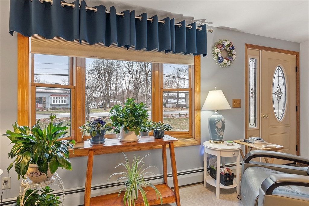 27 Lancaster Road Shirley, MA 01464 - Photo 11 of 41 a dining room with furniture and a potted plant