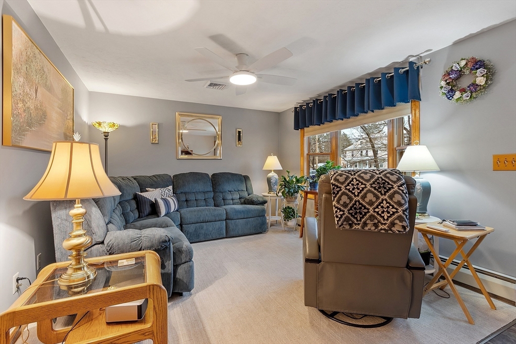 27 Lancaster Road Shirley, MA 01464 - Photo 12 of 41 a living room with furniture and a window