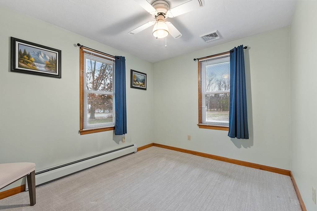 27 Lancaster Road Shirley, MA 01464 - Photo 18 of 41 an empty room with windows and fan