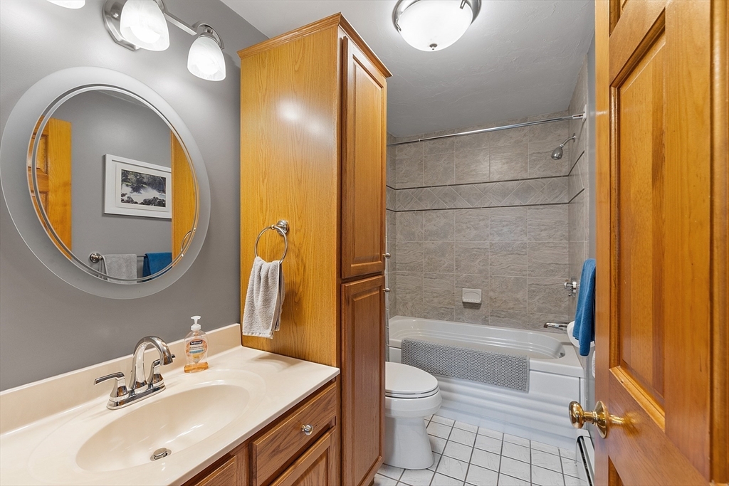 27 Lancaster Road Shirley, MA 01464 - Photo 23 of 41 a bathroom with a sink a toilet and shower