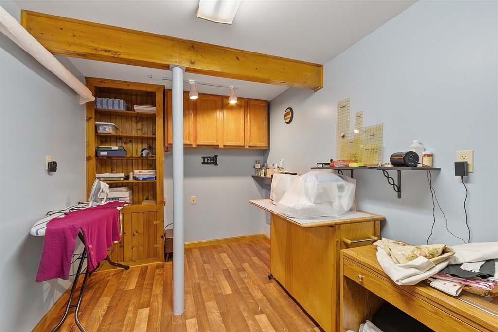 27 Lancaster Road Shirley, MA 01464 - Photo 27 of 41 a bed room with a bed and a table