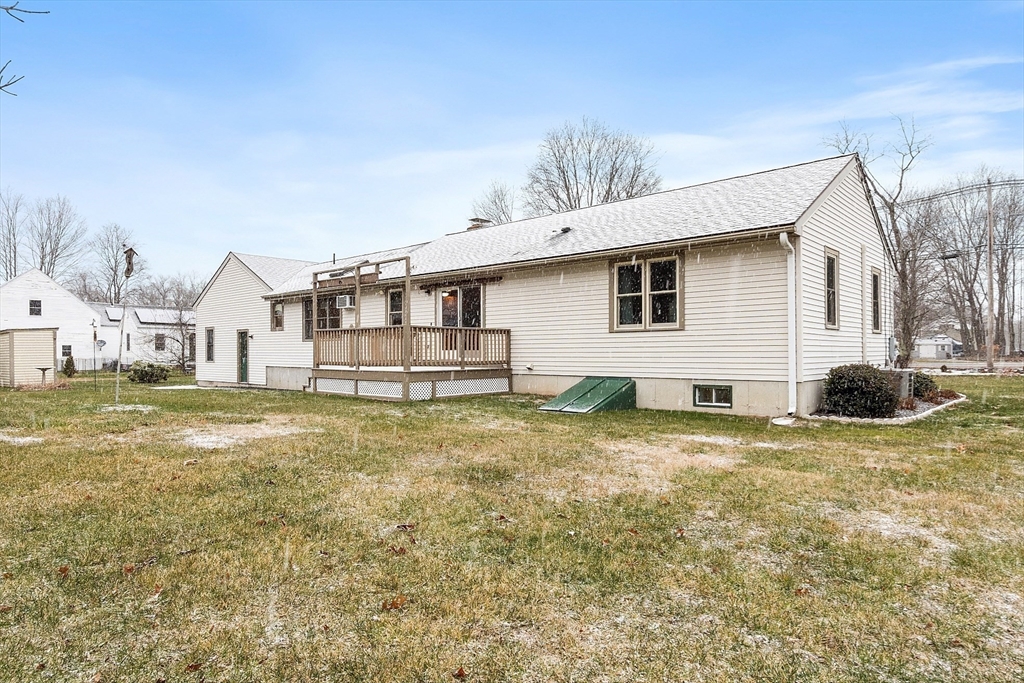 27 Lancaster Road Shirley, MA 01464 - Photo 34 of 41 a view of a house with a yard and sitting area