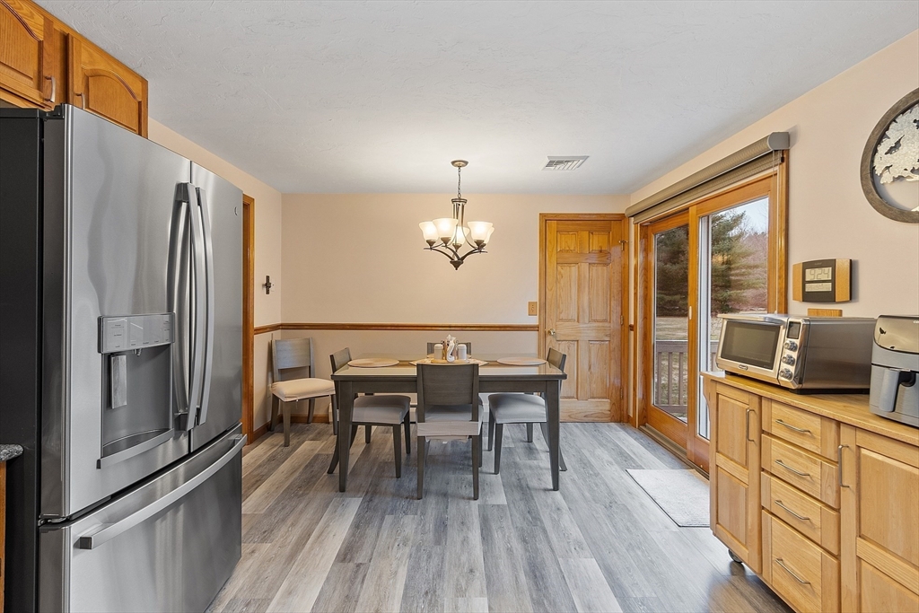 27 Lancaster Road Shirley, MA 01464 - Photo 7 of 41 a view of a dining room with furniture window and wooden floor