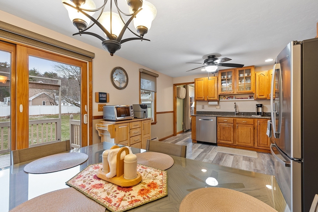 27 Lancaster Road Shirley, MA 01464 - Photo 9 of 41 a living room with stainless steel appliances furniture a rug and a large window