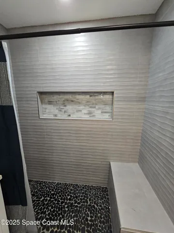 a view of a room with a wooden door