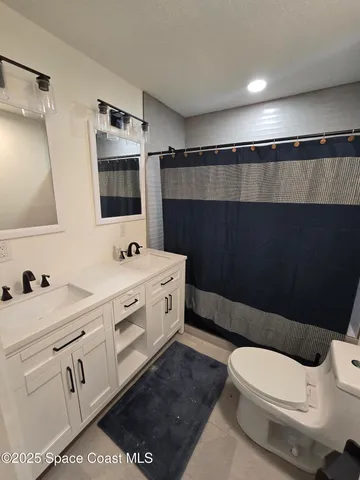 a room with a bed and a walk in closet