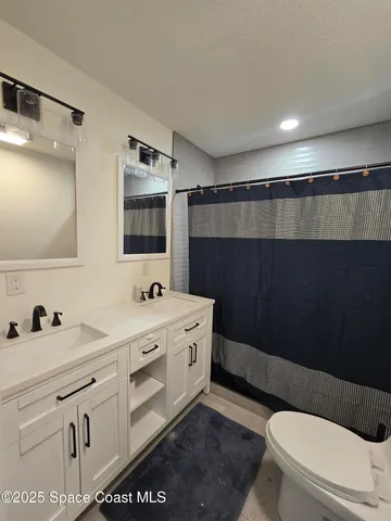 a view of a kitchen with a stove top oven