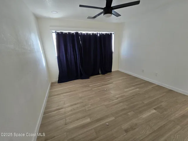 a view of outdoor space with wooden floor