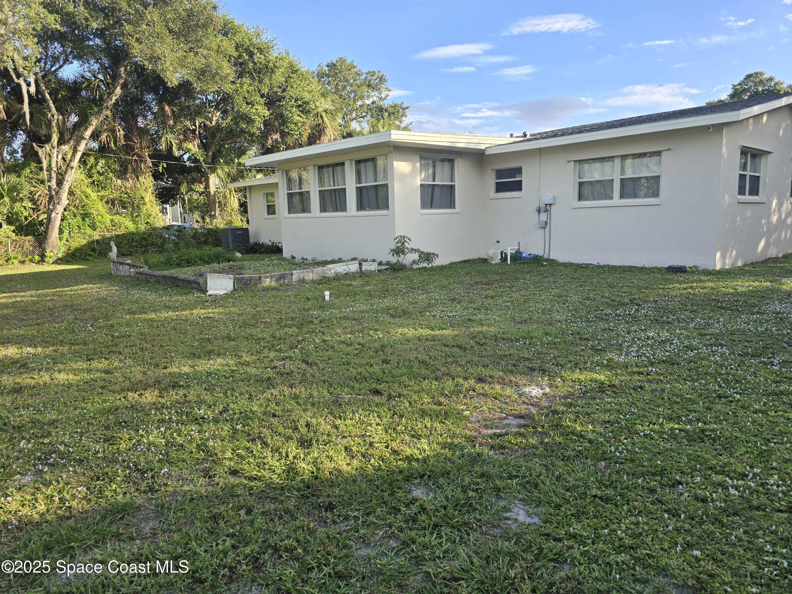 2417 Colonial Drive Melbourne, FL 32901 - Photo 60 of 64 a front view of house with yard and green space